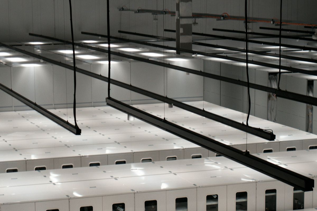 Rows of server cabinets in a data centre