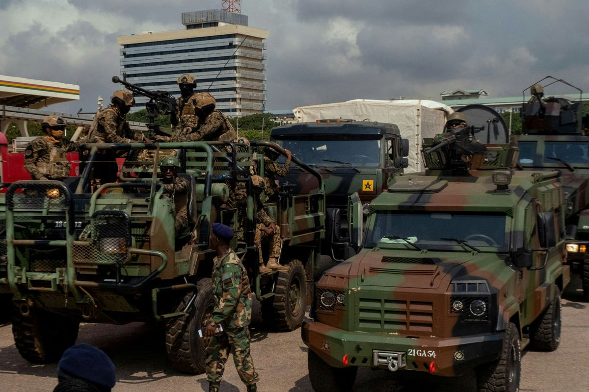 Nigerian military vehicles and troops on a city street