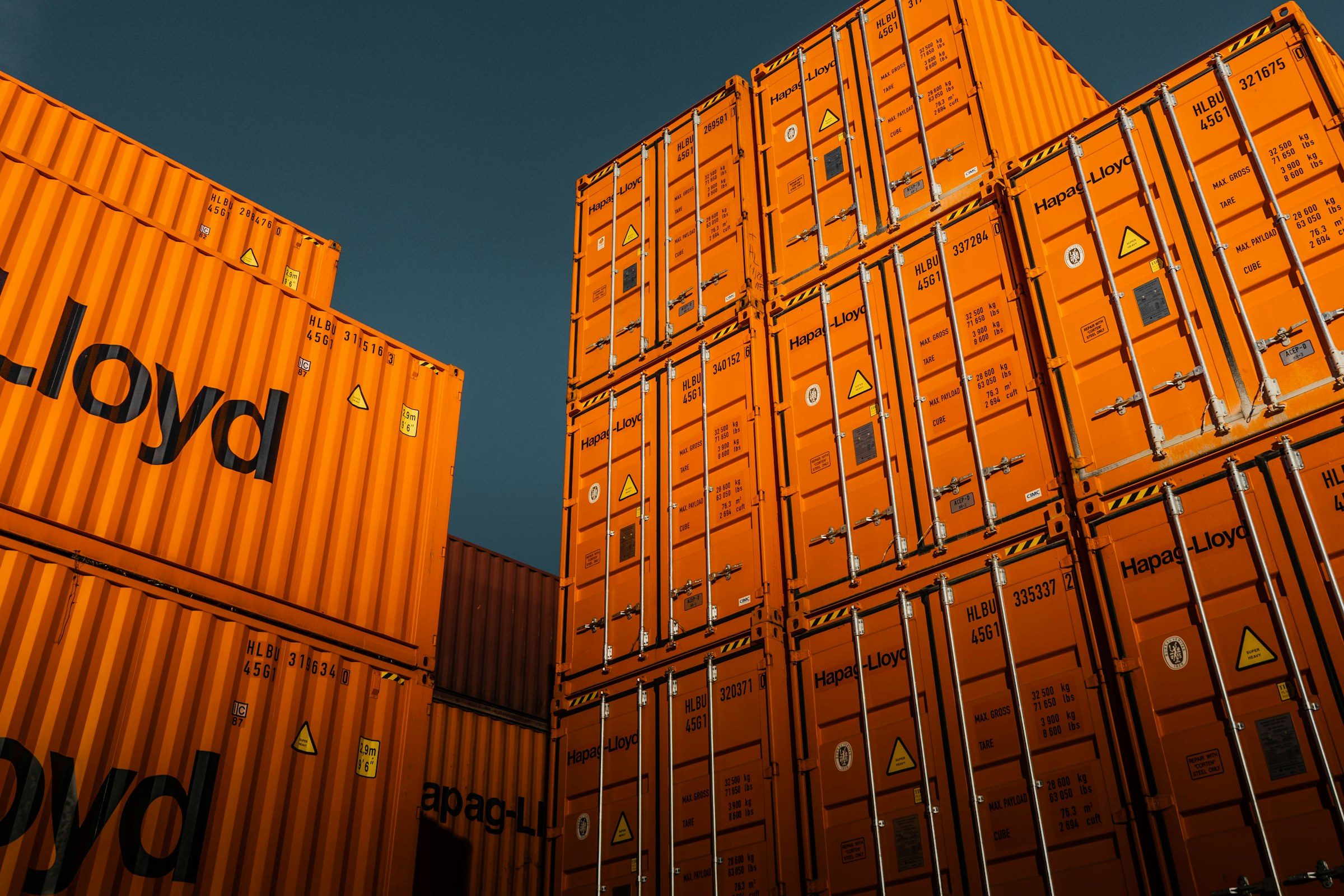Stacked orange shipping containers