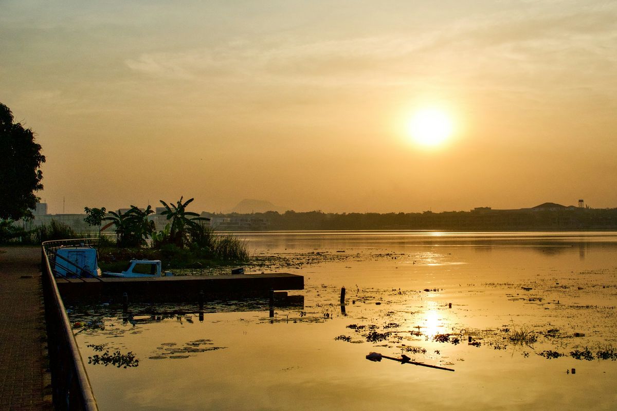 Sunset over a still body of water