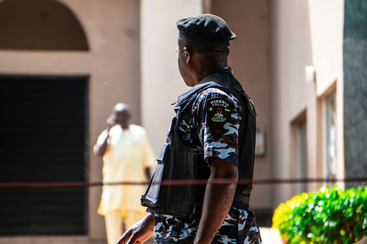 A Nigerian police officer seen from behind
