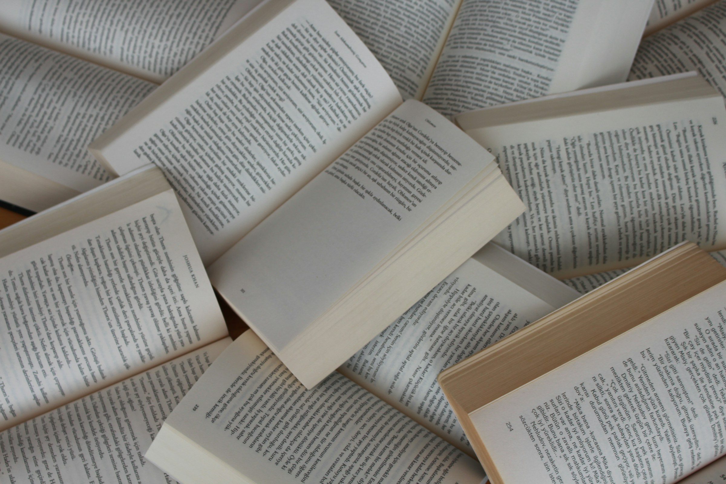 A pile of open books