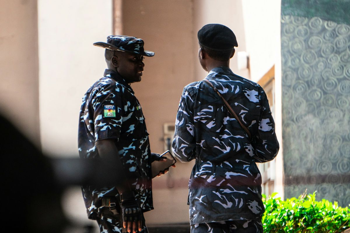 Two Nigerian police officers seen from behind