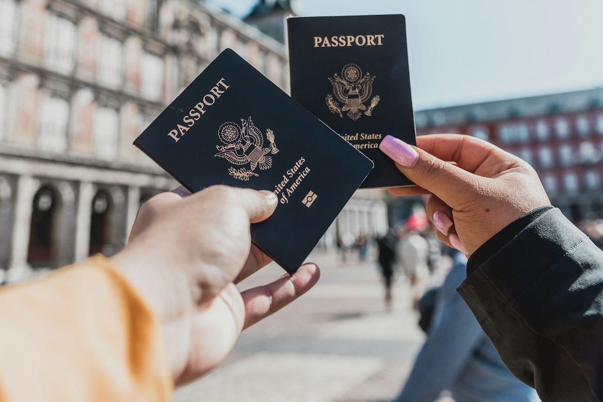Hands holding passports