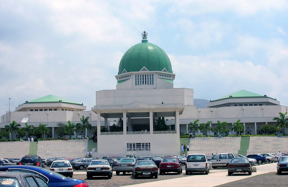 The domed National Assembly building with cars parked in front