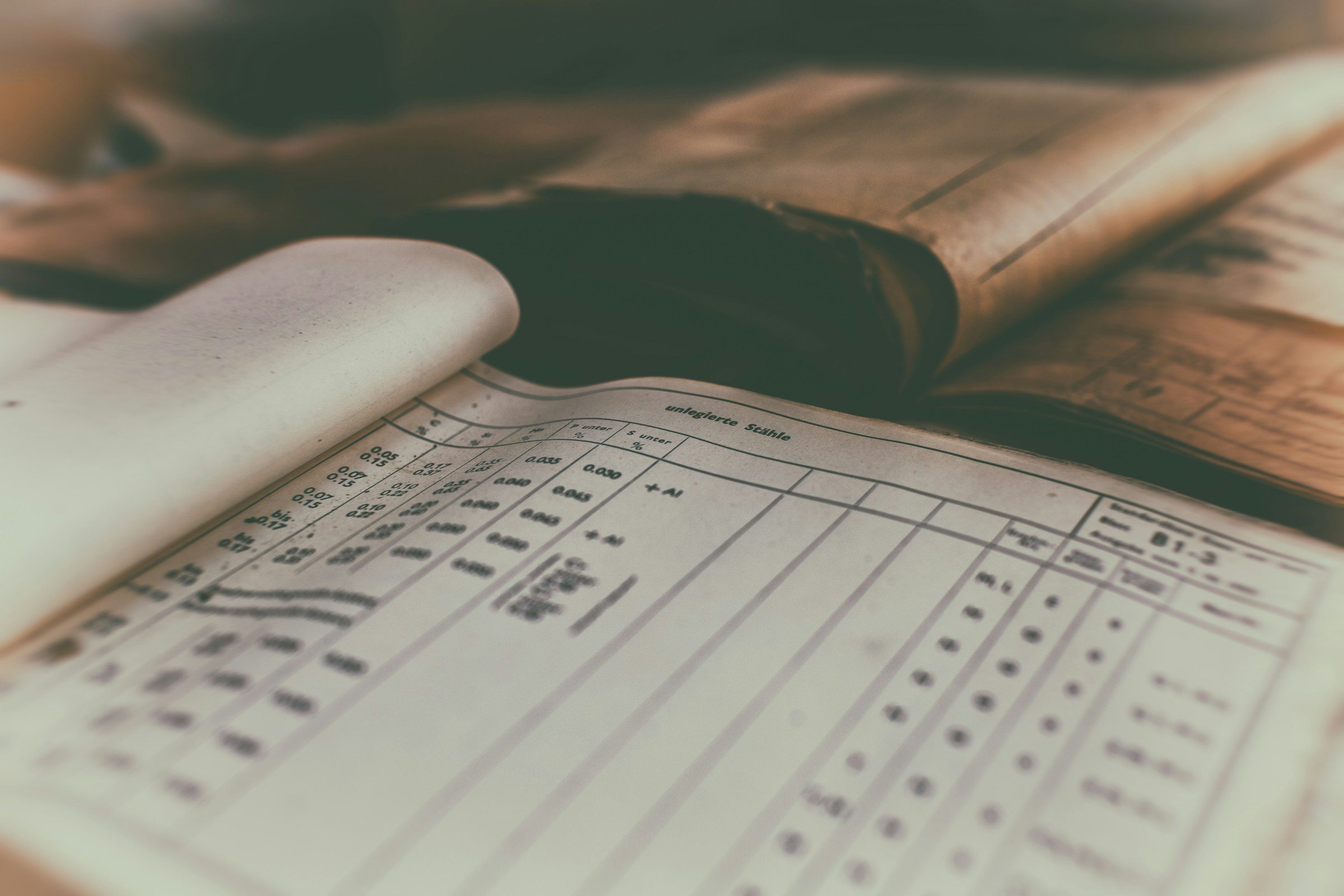 An open account ledger with columns of handwritten figures