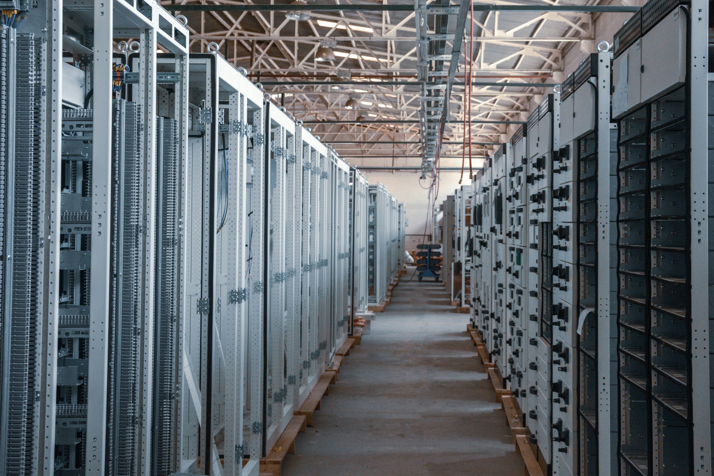 An aisle of server racks in a data centre