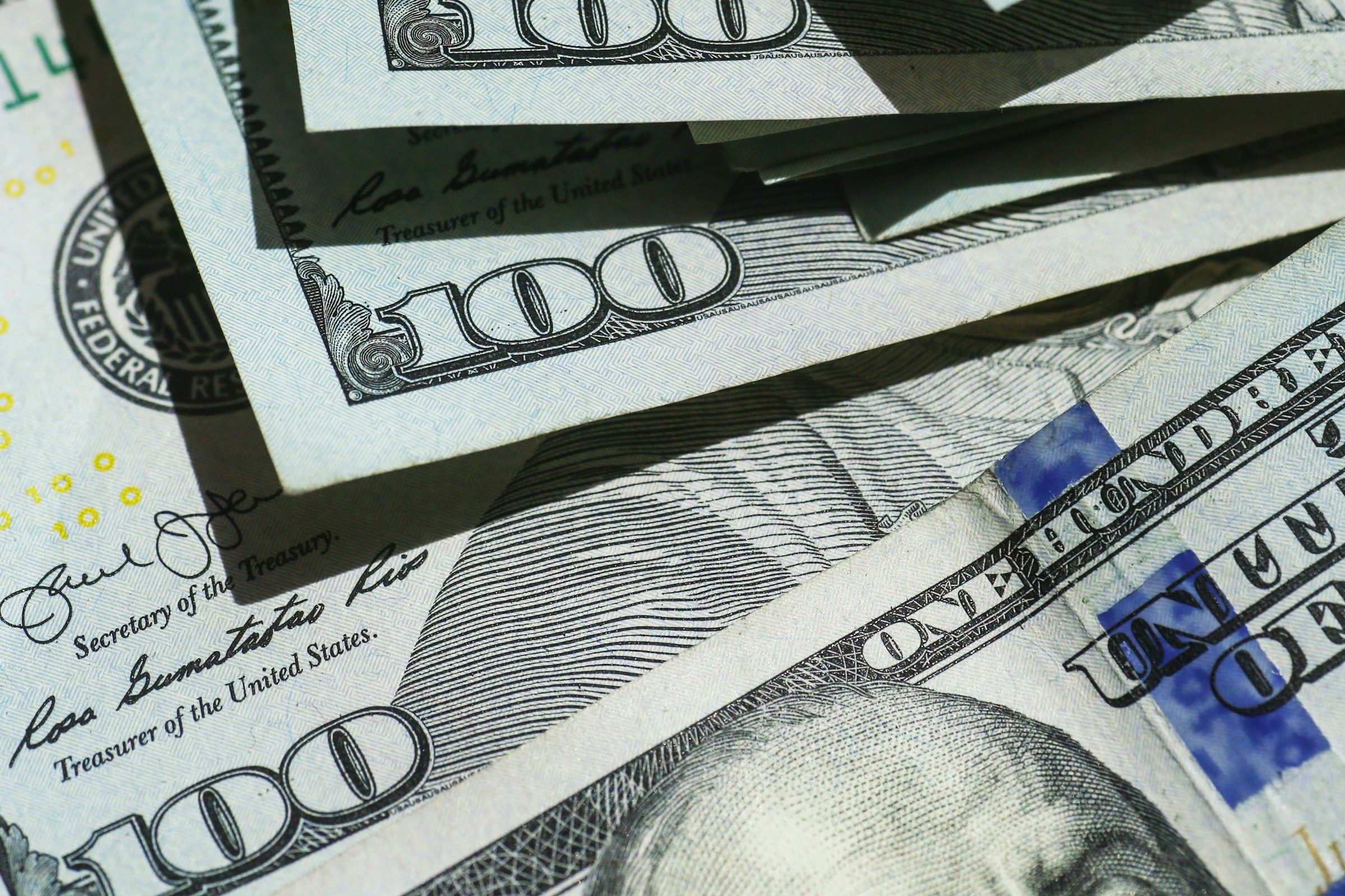 A close view of United States hundred-dollar bills