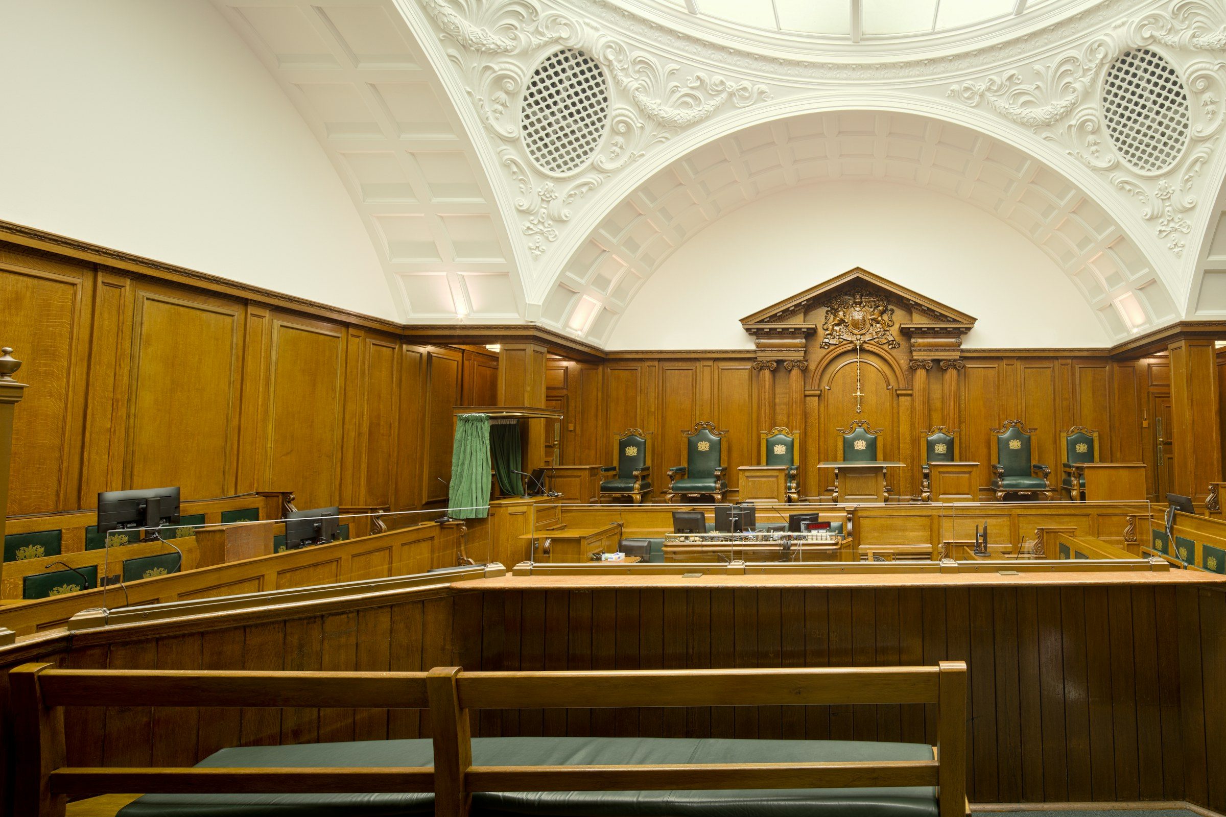 An empty wood-panelled courtroom