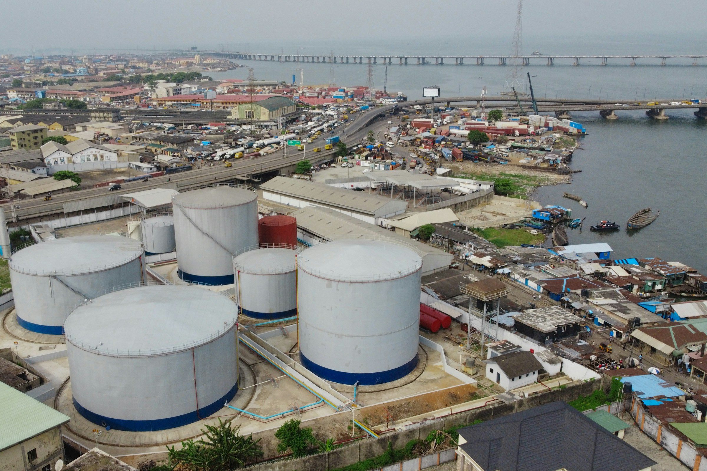 Petroleum storage tanks beside a Nigerian waterfront