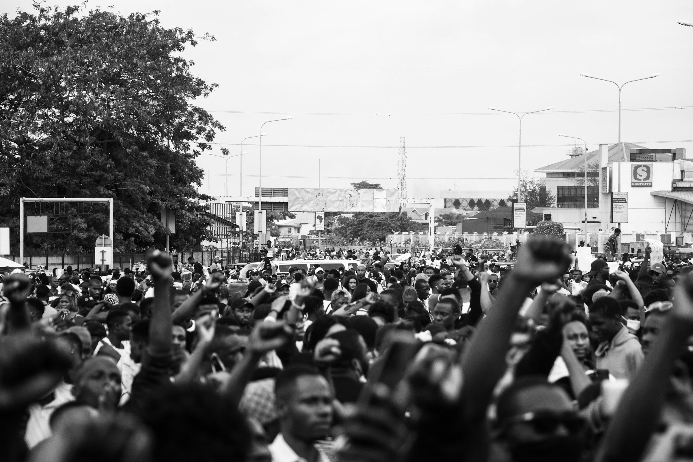 A crowd in the street, in black and white