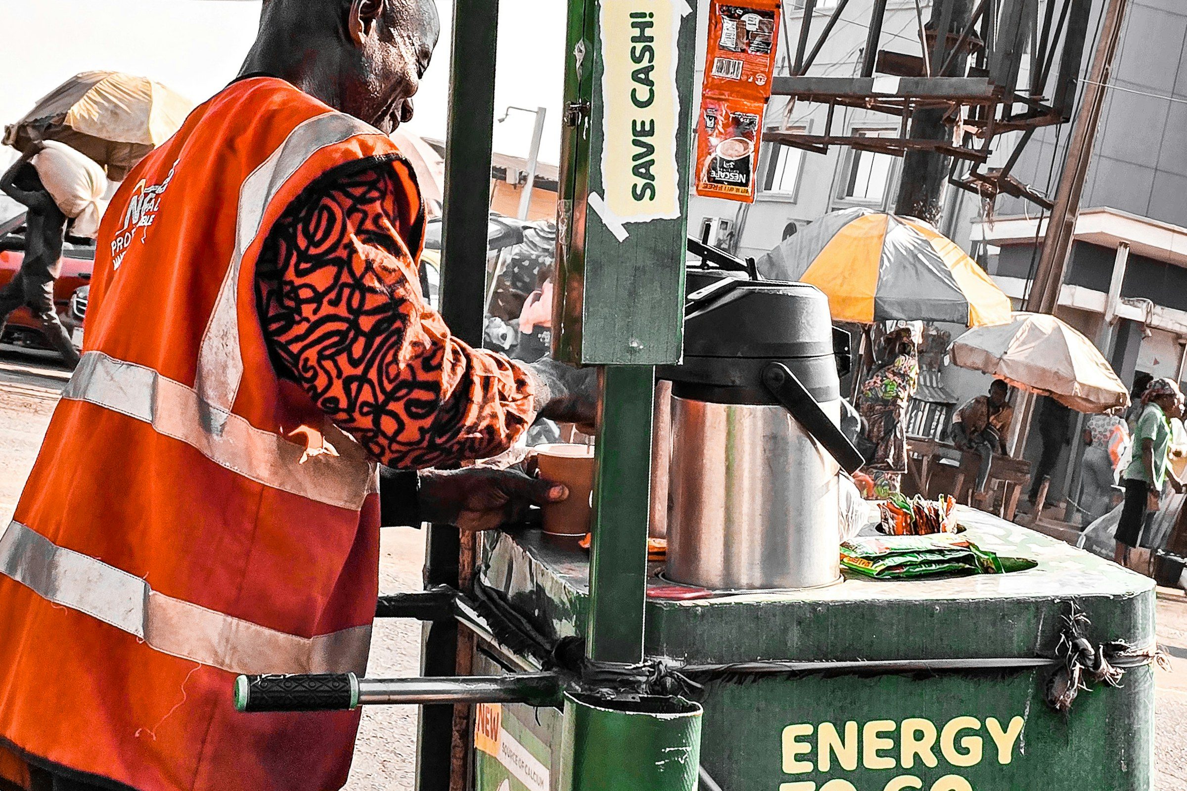 A pump attendant at a Nigerian fuel station